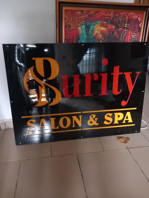 Purity Salon and Spa acrylic sign unlit in daylight