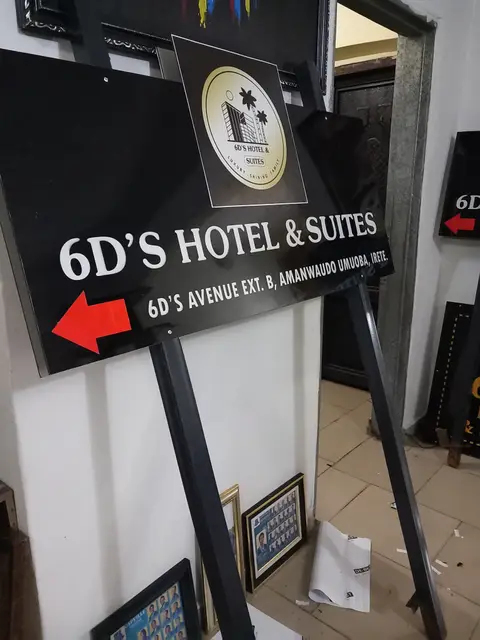 Directional arrow sign for 6D's Hotel & Suites Owerri in the workshop