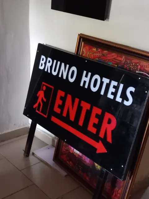 Illuminated enter sign with arrow fabricated for Bruno Hotels