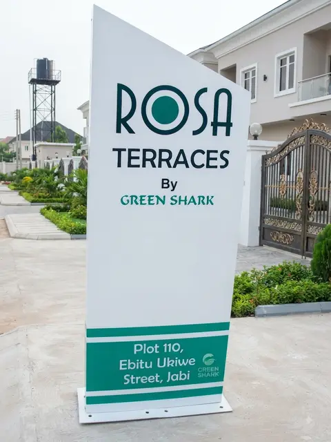 White architectural totem for Rosa Terraces estate by Green Shark in Jabi Abuja