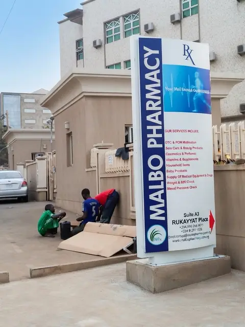 Curved-top pharmacy pylon sign for Malbo Pharmacy in Utako Abuja